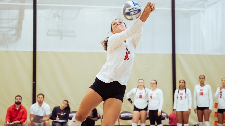 Volleyball Edged by Trinity, 3-2, at UMB Tournament